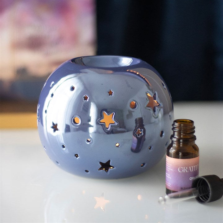 IRIDESCENT STAR ÖLLAMPE UND WACHSWÄRMER